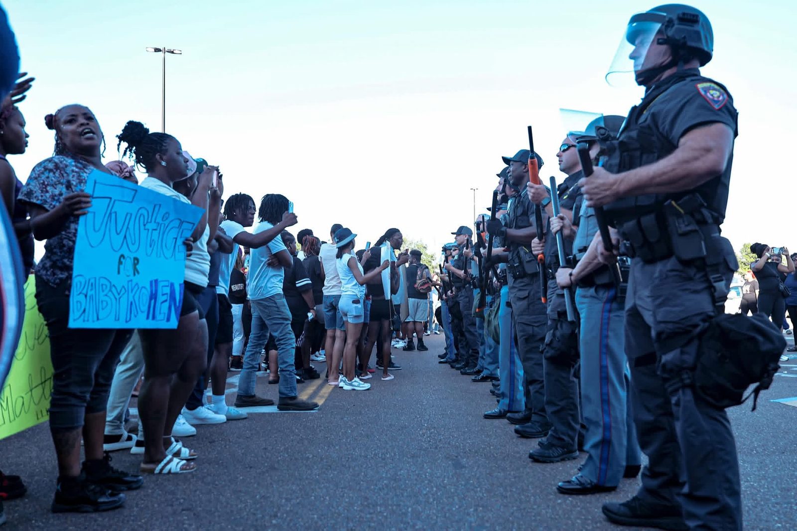 Protesters facing the police line